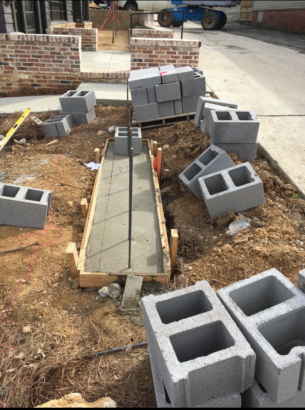 A bunch of concrete blocks are laying on the ground.