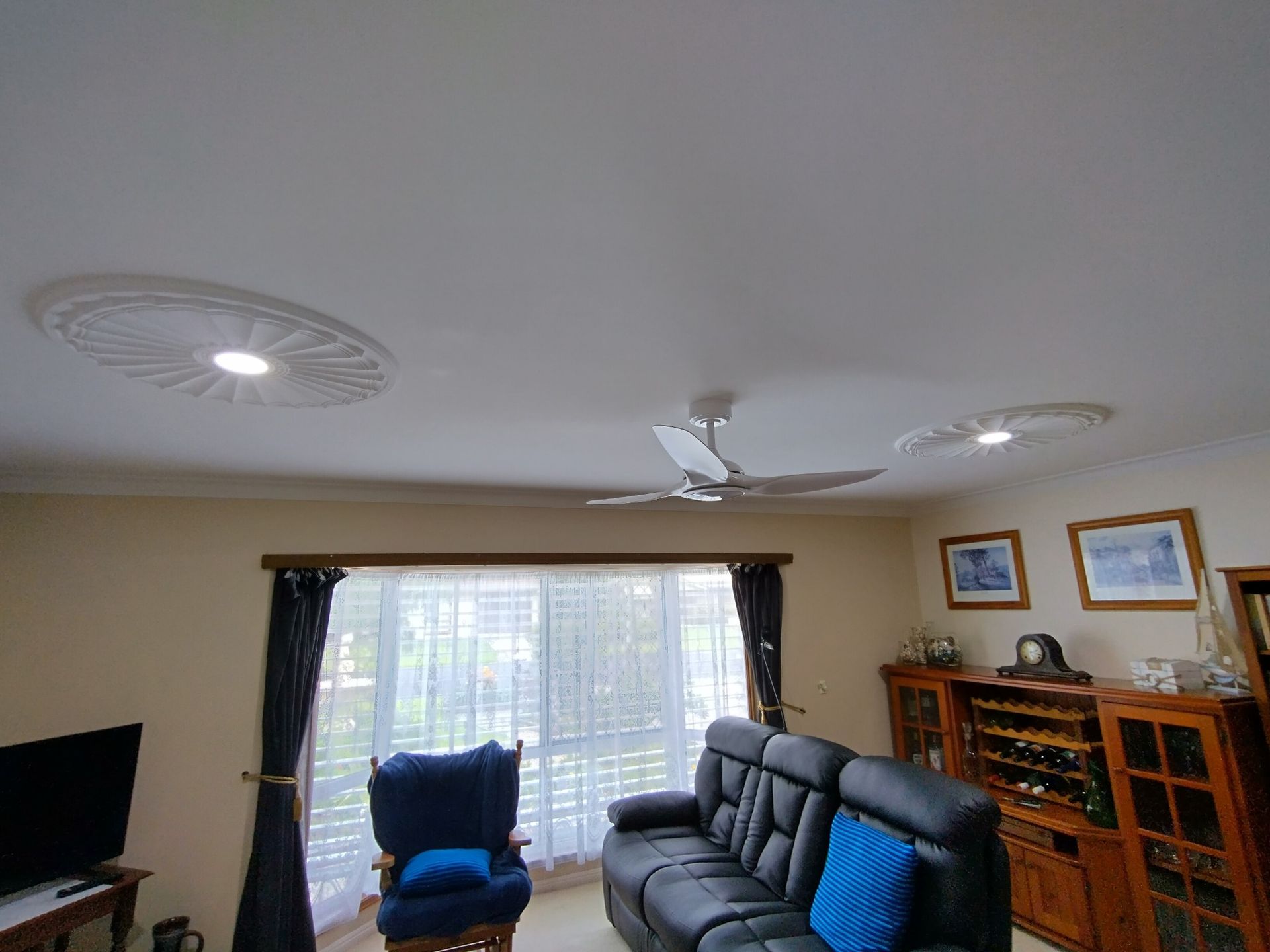 Bedroom With Two Twin Beds, One Under a Window — NTR Electrical In Toogoom, QLD