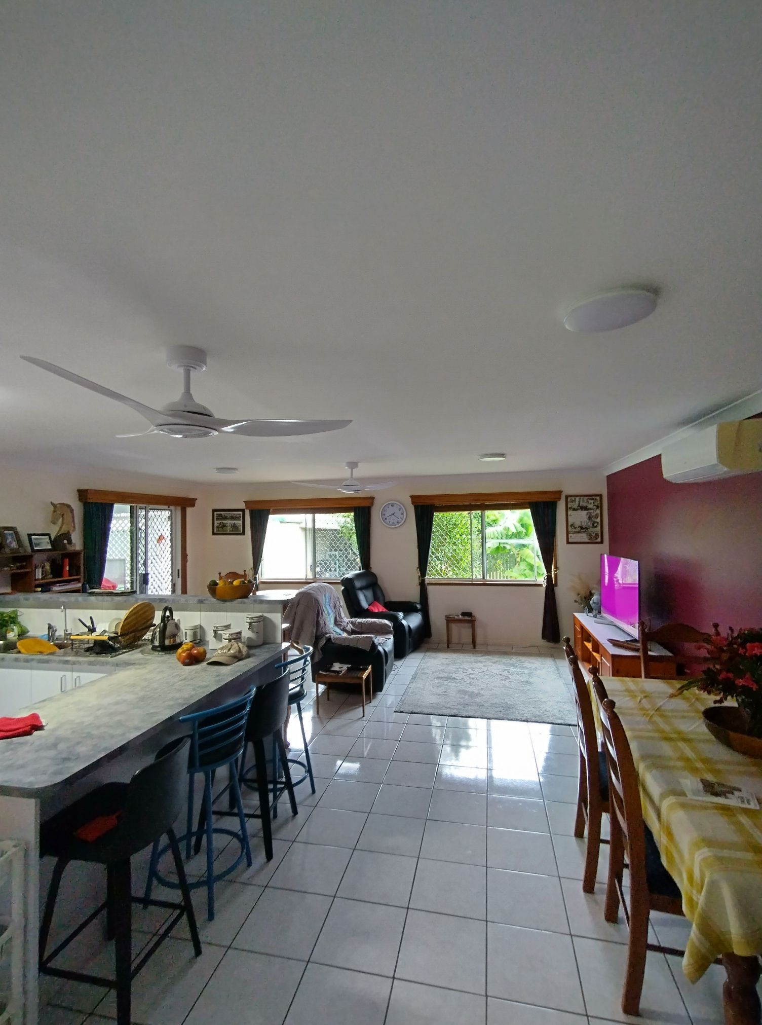 Open-plan Living Space With Kitchen Island — NTR Electrical In Toogoom, QLD