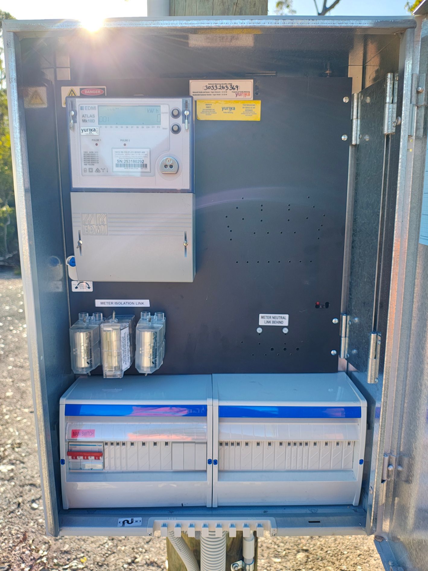 Electrical Panel With Three Circuit Breakers Labeled Main Switch, Outdoor Current 5, and Electric Light 1 — NTR Electrical In Toogoom, QLD