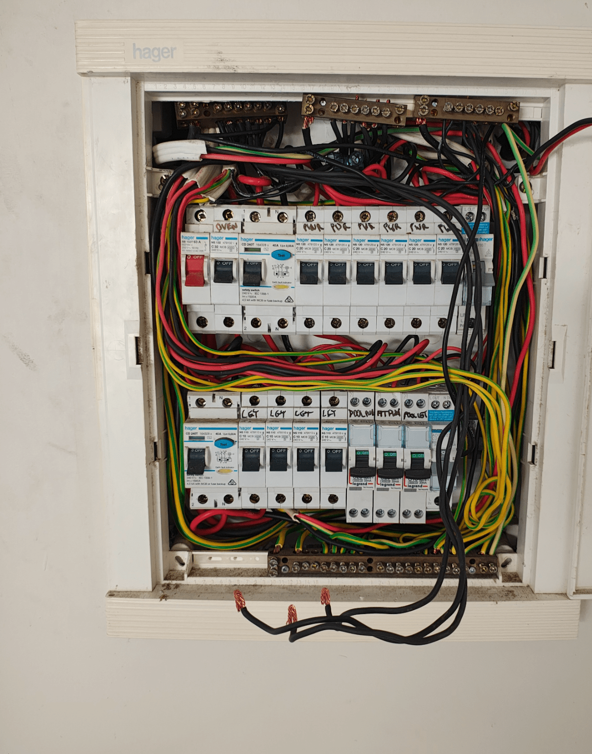 Electrical panel with numerous colored wires and circuit breakers — NTR Electrical In Toogoom, QLD