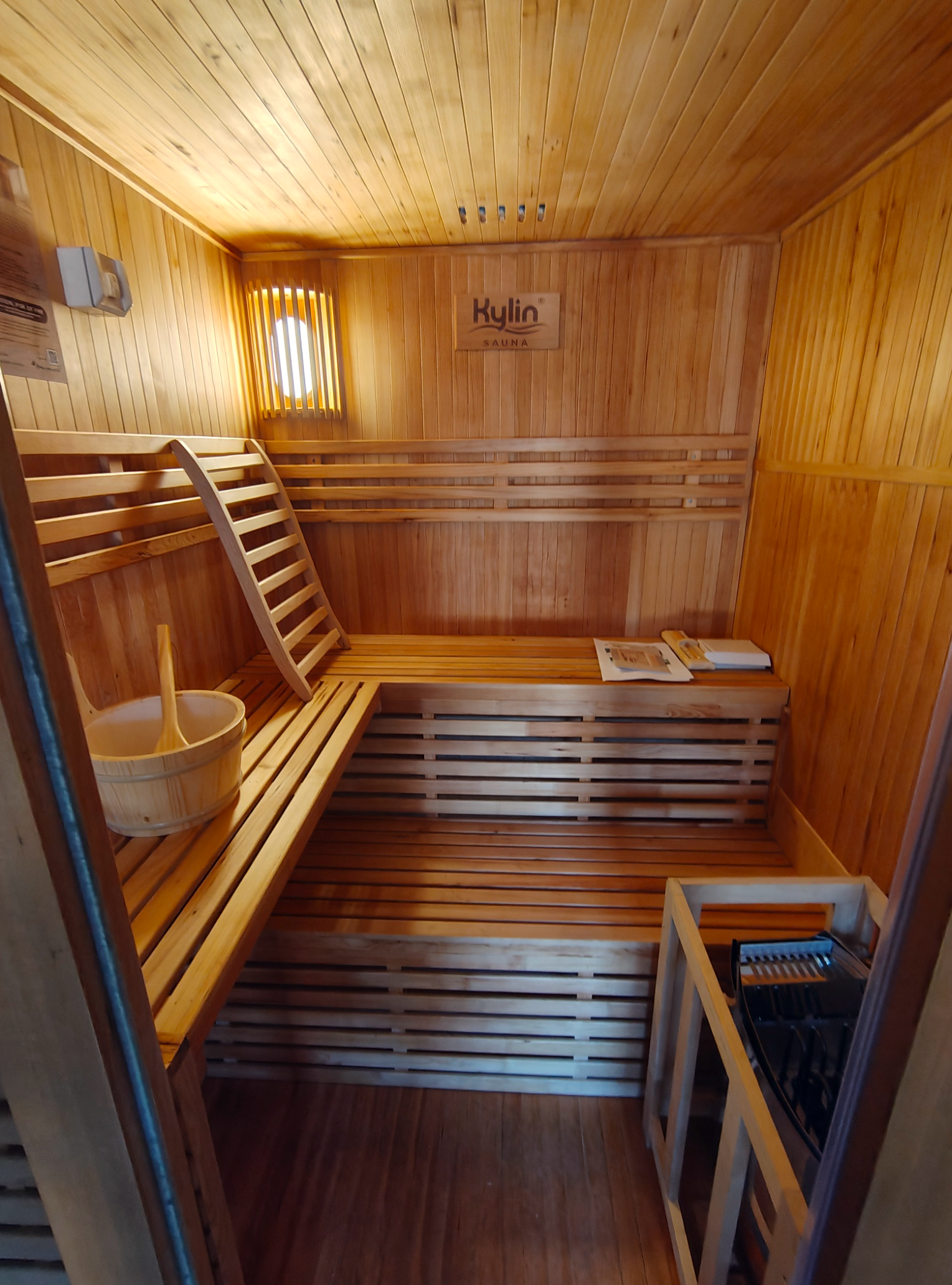 Living Room Interior With a Ceiling Fan, Black Sofa, Window, and Decorative Ceiling Details — NTR Electrical In Toogoom, QLD