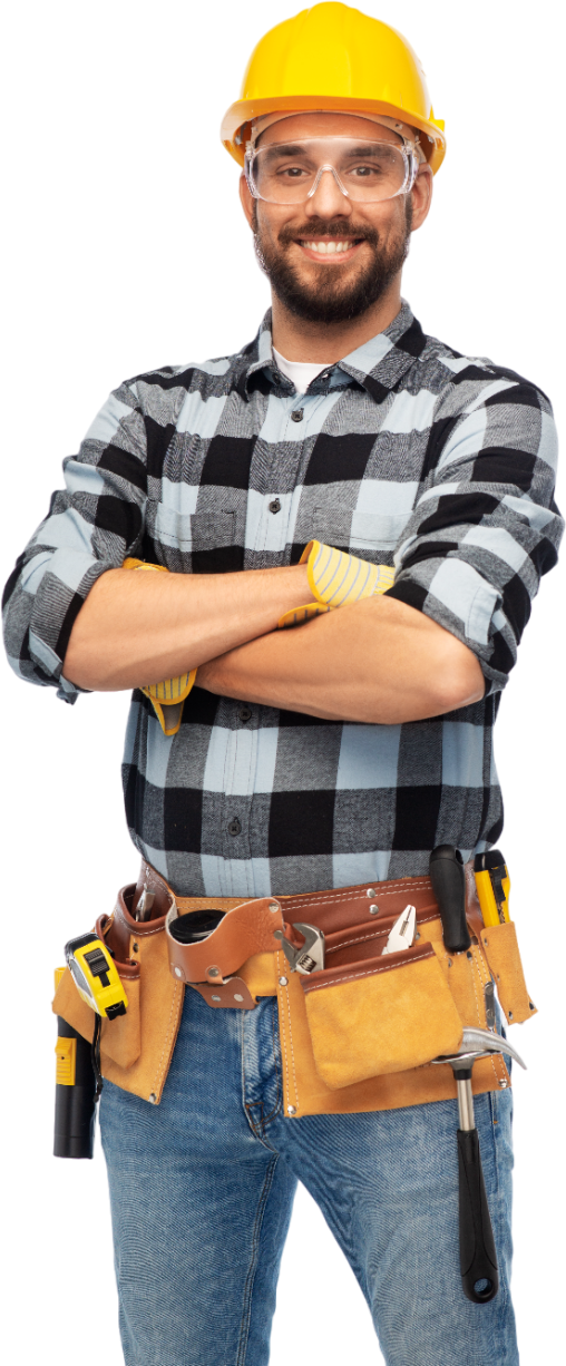 a man wearing a hard hat and safety glasses is standing with his arms crossed