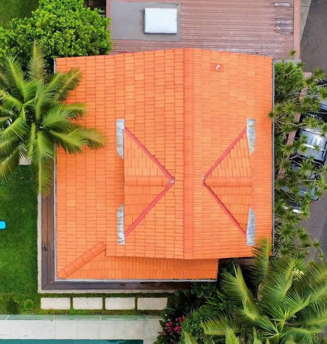 An Aerial View Of A House With An Orange Tiled Roof And A Swimming Pool — Freshwater Exterior Cleaning in Lennox Head, NSW