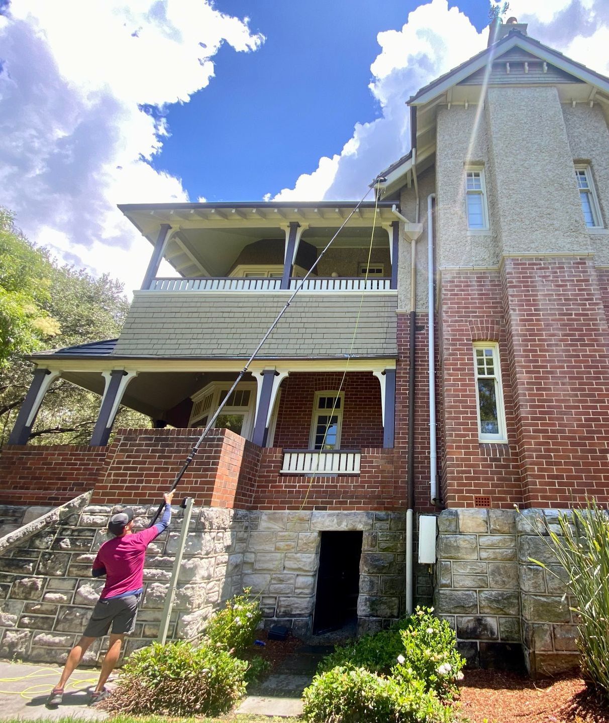 Man Cleaning A large House — Freshwater Exterior Cleaning in Bayron Bay, NSW