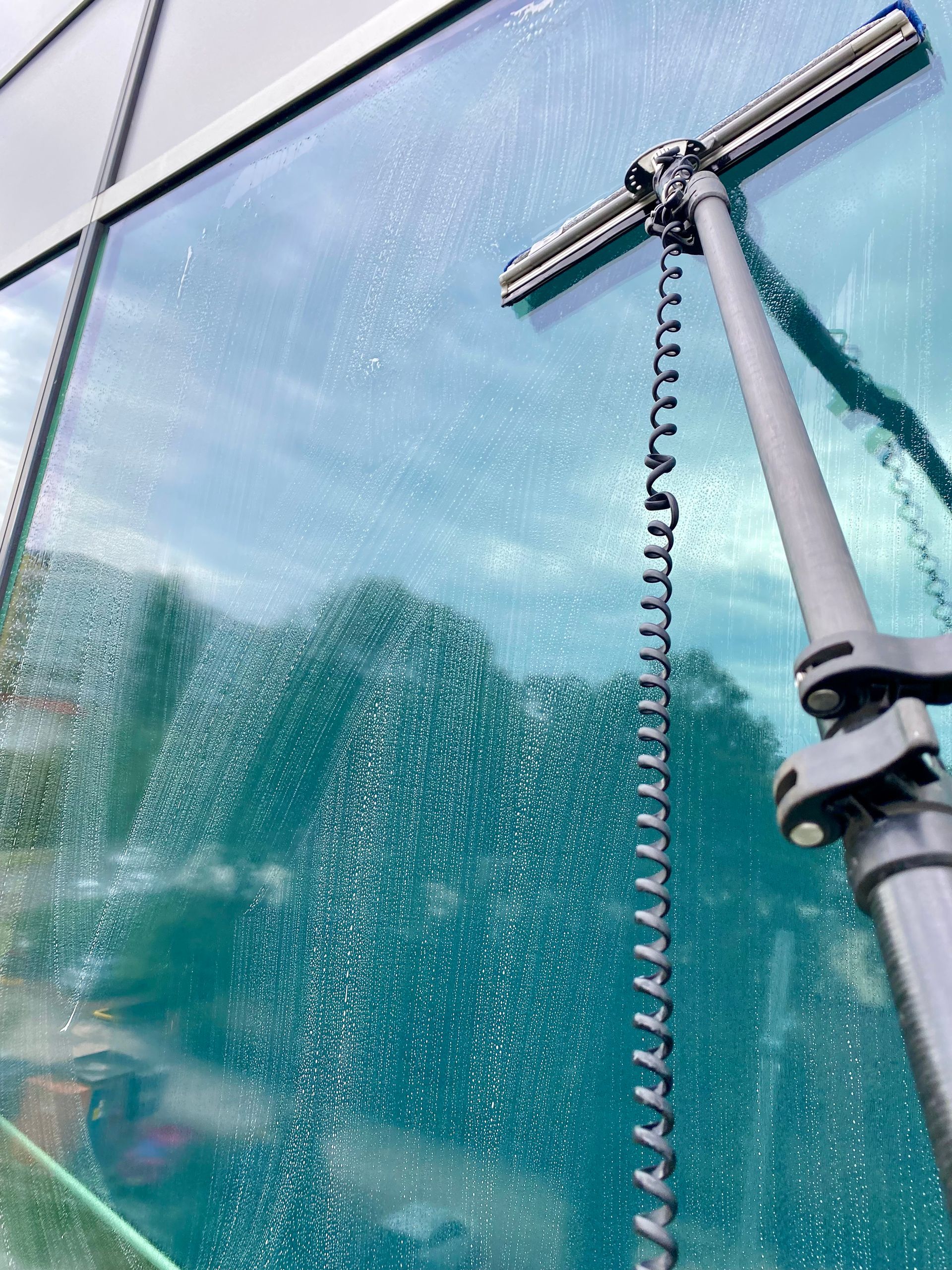 Squeegee Cleaning Glass— Freshwater Exterior Cleaning in Alstonville, NSW