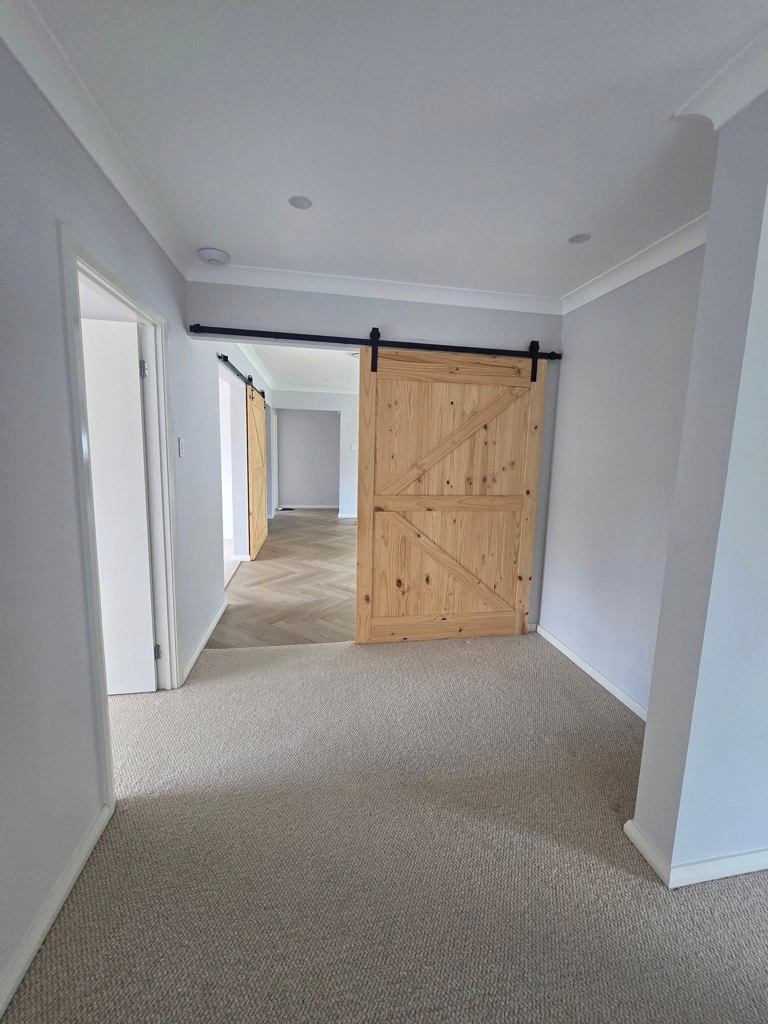 Hallway to the Bedroom and Bathroom Having a Kitchen on Left side — A Perfect Move And Clean In Mittagong NSW