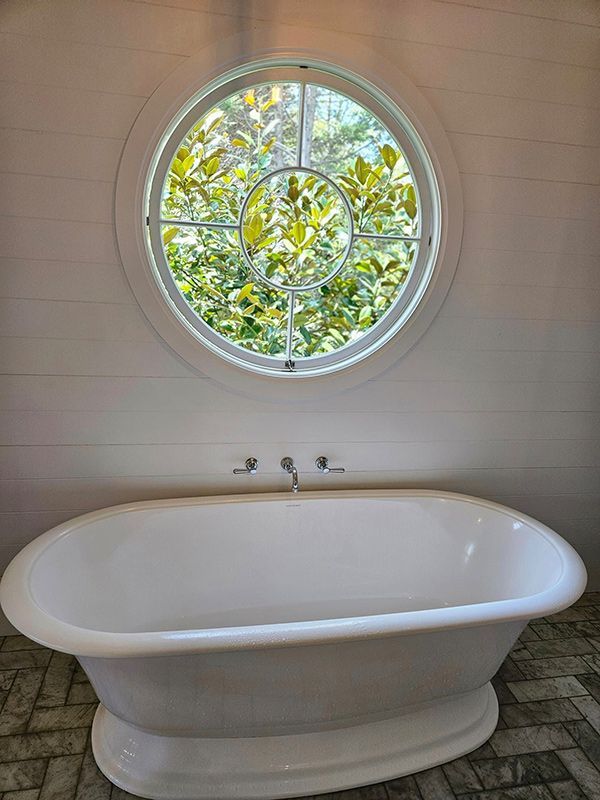 Empty White Bathtub with Three Taps — A Perfect Move And Clean In Mittagong NSW