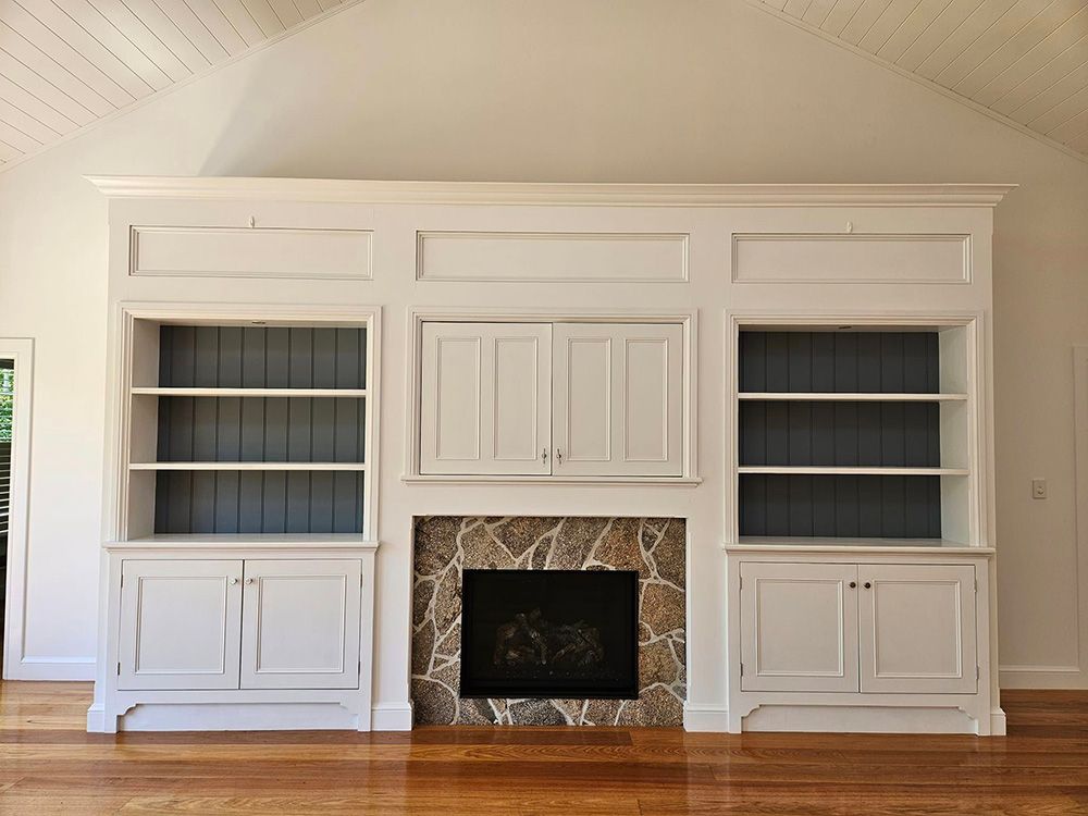 Empty Big White Cabinet with White Wall and Three Shelves on either side each — A Perfect Move And Clean In Welby NSW
