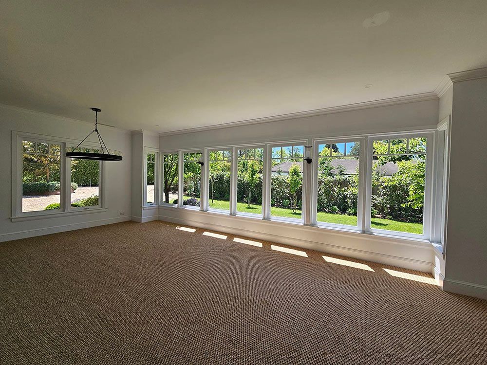 Empty Room With Nine Open Windows And Sun Rays Coming Inside — A Perfect Move And Clean In Welby NSW