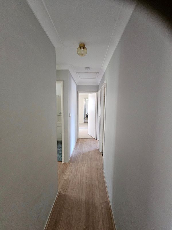 Hallway in the House with Yellow Light on the Ceiling— A Perfect Move And Clean In Bowral NSW