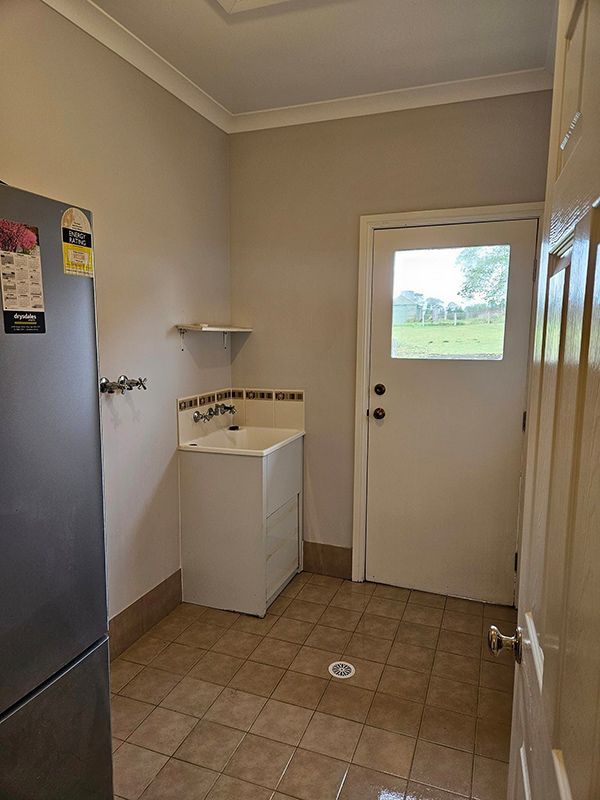 Laundry Room with Sink and Refrigerator — A Perfect Move And Clean In Mittagong NSW