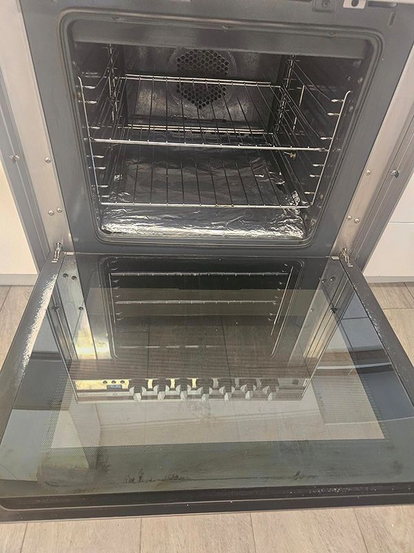 Clean Oven with Open Door having Two Trays — A Perfect Move And Clean In Mittagong NSW