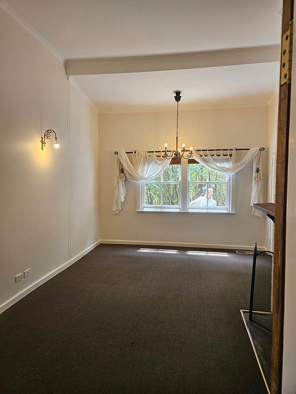 Room with Lights on Ceiling and Wall and Beautiful White Curtains on the Window — A Perfect Move And Clean In Moss Vale NSW