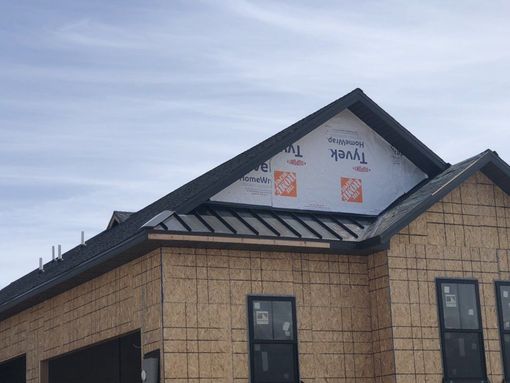 A house is being built with a roof that is covered in styrofoam.
