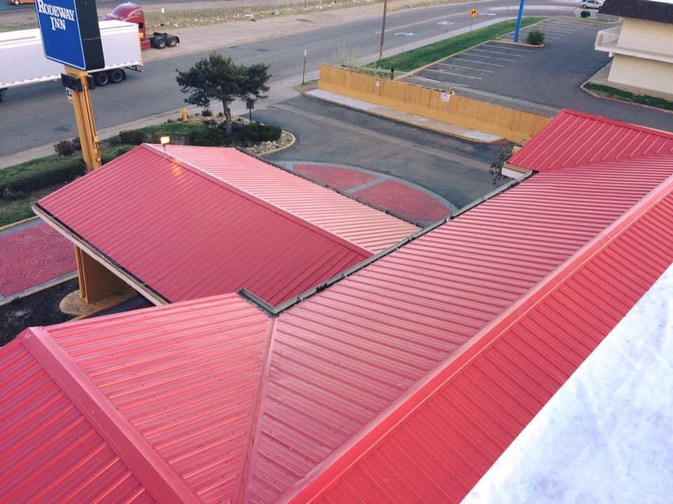 An aerial view of a red roof of a building