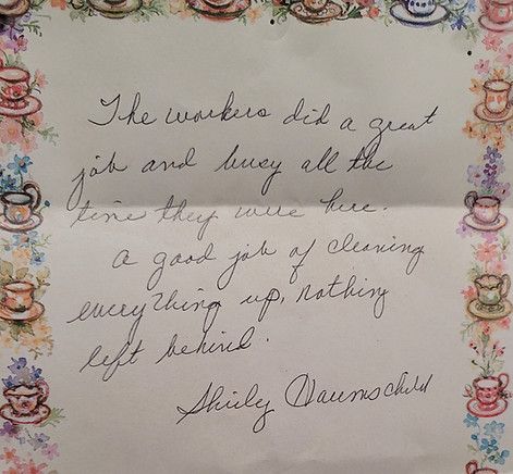 A handwritten letter with a floral border and the words `` the workers did a great job and busy all the time . ''