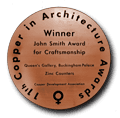 A copper coin that says copper in architecture winner john smith award for craftsmanship