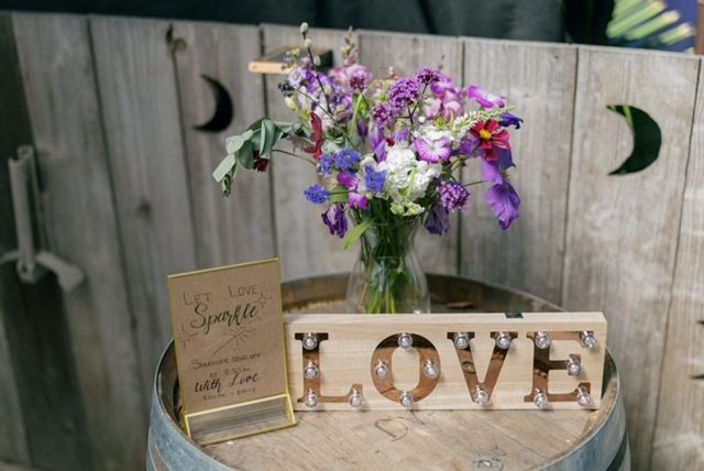 Wooden barrel with floral arrangement, 