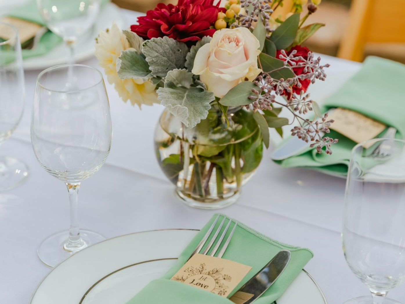 Table setting with floral centerpiece and place setting.