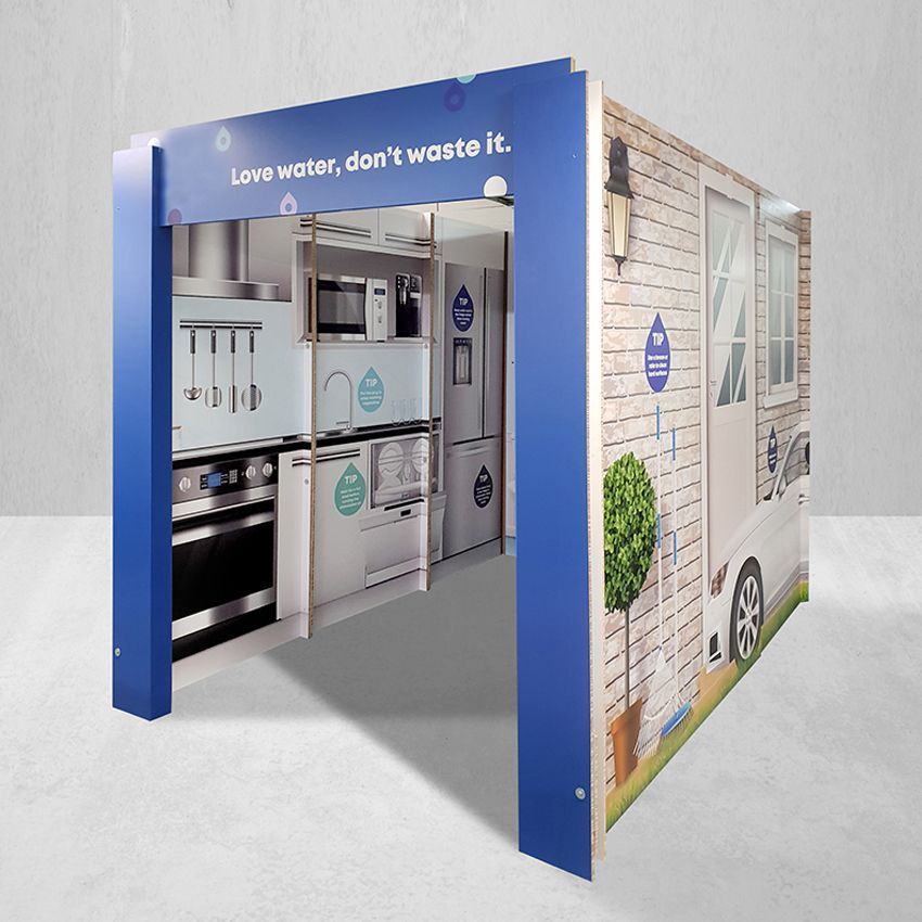 A kitchen with a sign that says love water don 't waste it