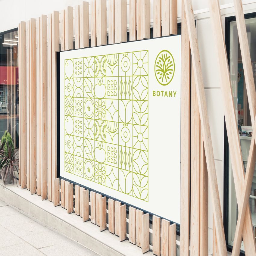 A large billboard is hanging on the side of a building.