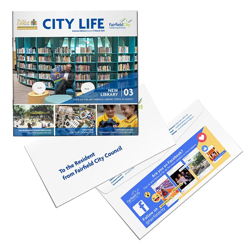 A book titled city life is sitting on top of an envelope