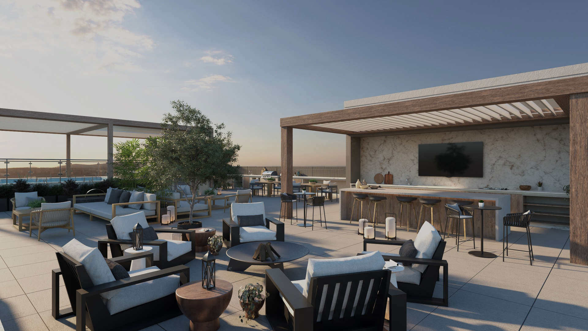 Rooftop deck with seating areas, bar, and pergola under a sunny sky.
