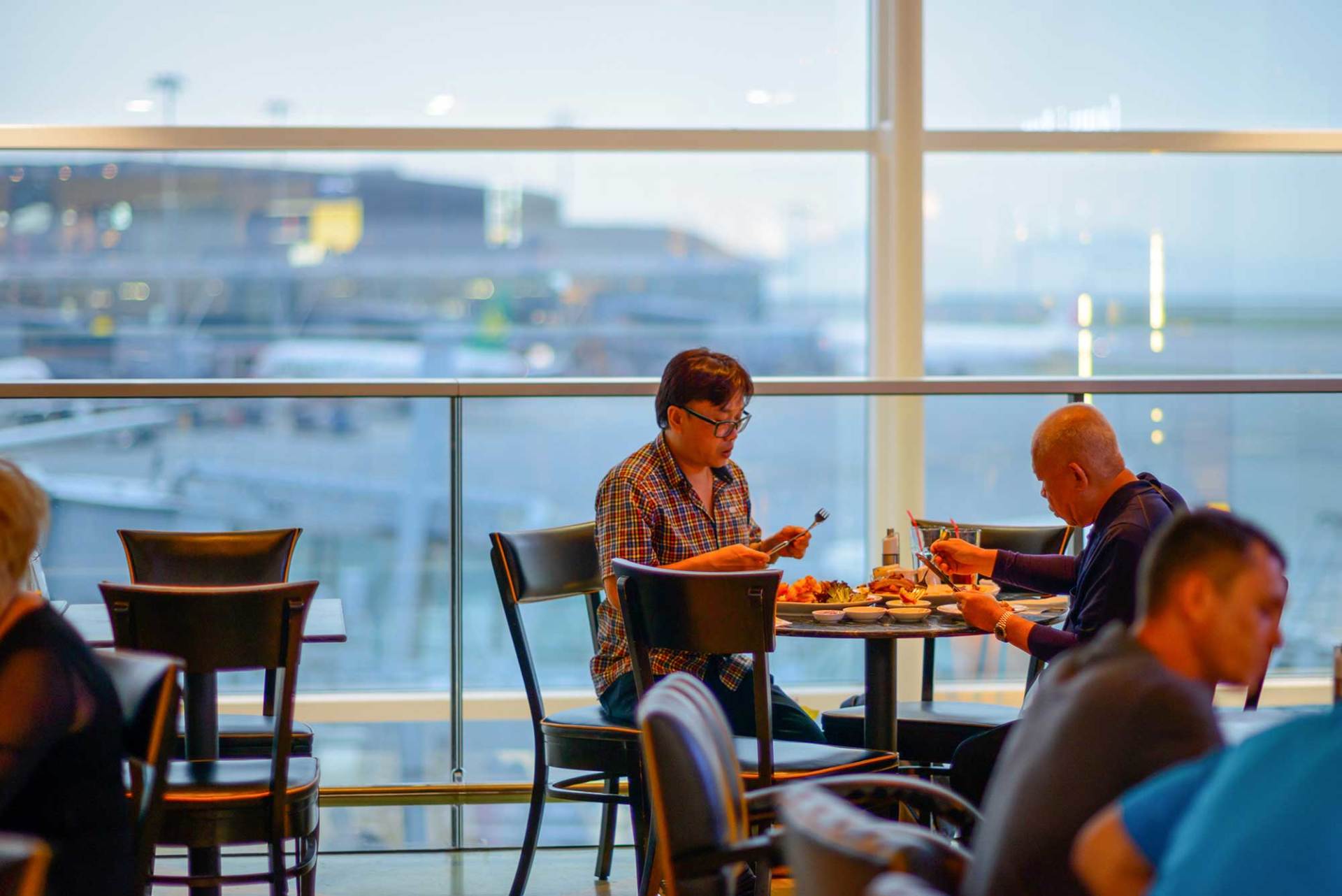 People eating at an airport