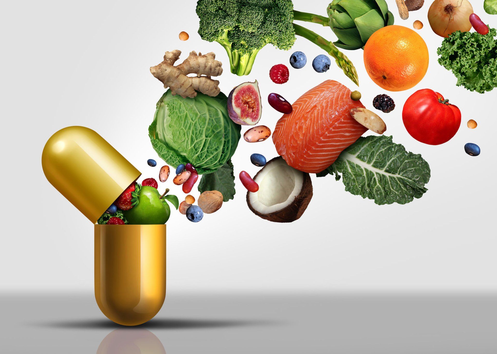 A pill capsule opening and releasing a variety of healthy foods including salmon, coconut, greens.