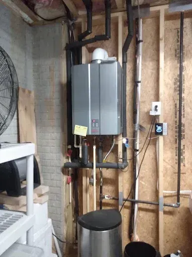 Tankless water heater installation in a basement. 