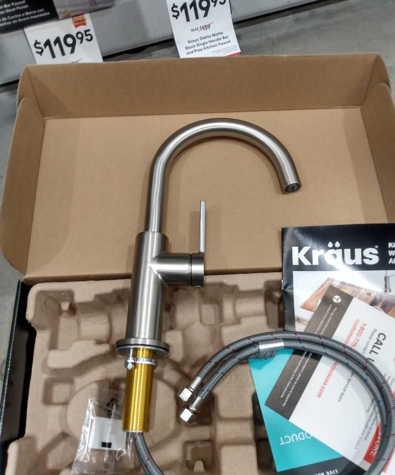 Kraus kitchen faucet in box; stainless steel with silver-gray hose.