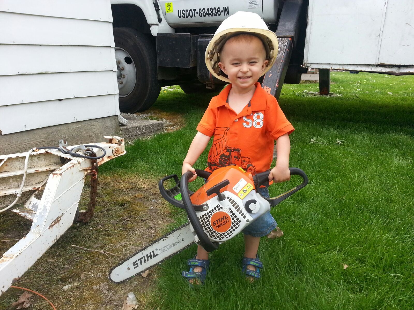 Kid Holding a Chainsaw — West Middleton, IN — Rice Tree Company Inc.