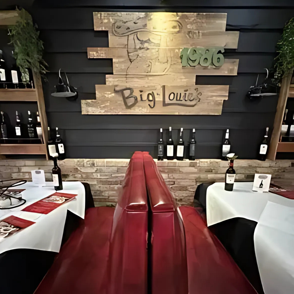 Big Louie’s Pizzeria dining booth with tables and décor