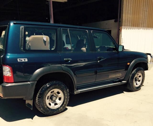 A Blue Suv With the Letters ST on the Side — Alice Crash Repairs In Ciccone, NT
