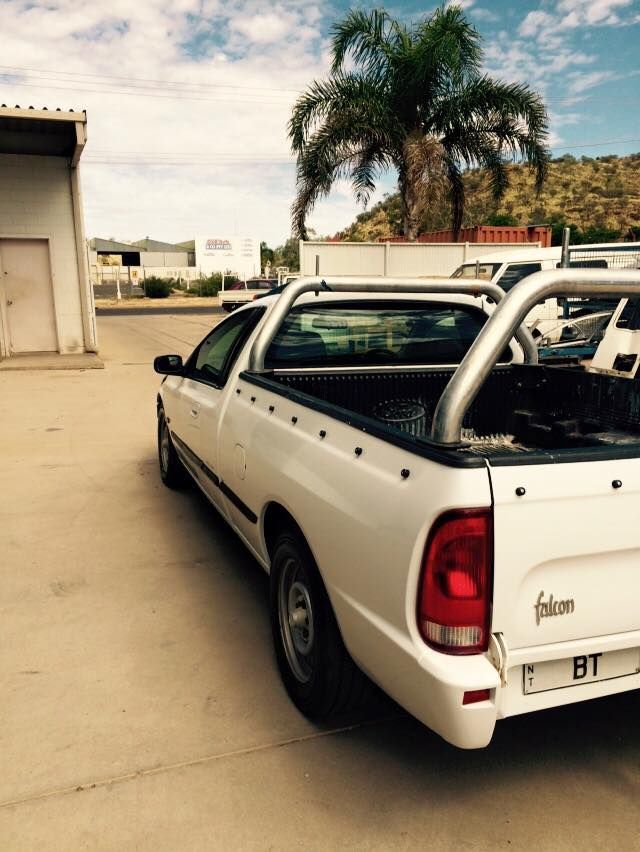 A White Falcon Truck is Parked in a Parking Lot — Alice Crash Repairs In Ciccone, NT