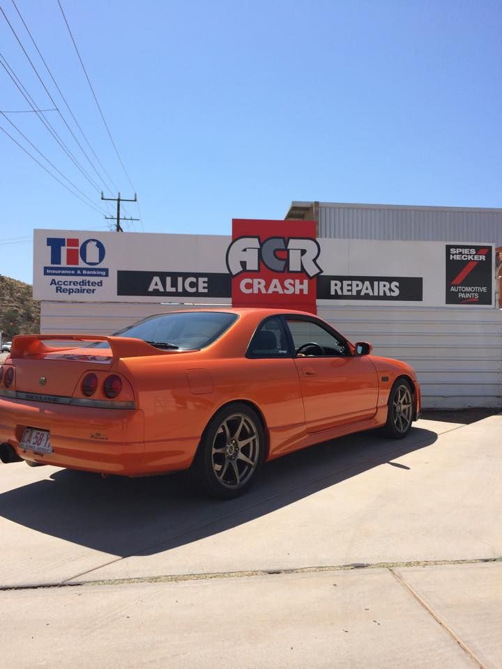 An Orange Car is Parked — Alice Crash Repairs In Ciccone, NT