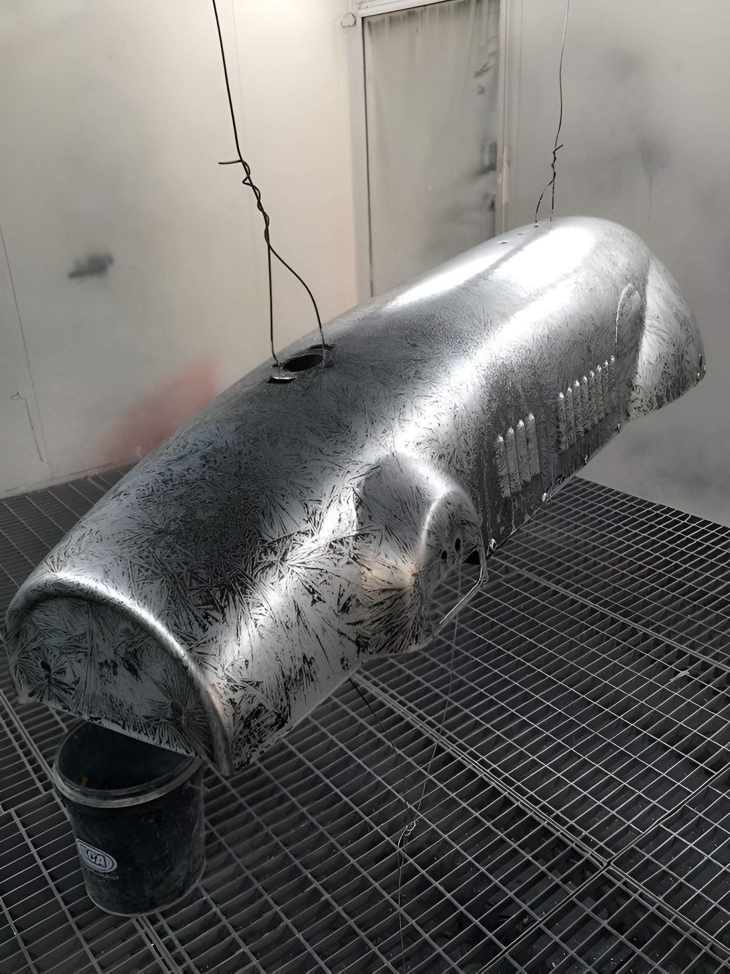 A Metal Object is Hanging From the Ceiling in a Room — Alice Crash Repairs In Ciccone, NT