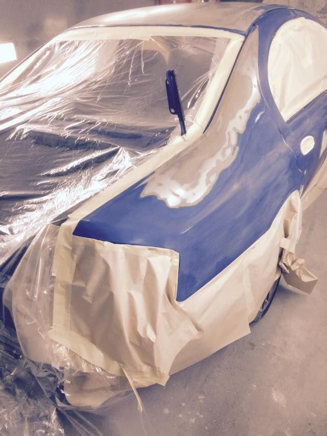 A Blue and White Car is Covered in Plastic Wrap — Alice Crash Repairs In Ciccone, NT