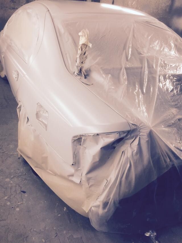 A Car is Wrapped in Plastic and Ready to Be Painted — Alice Crash Repairs In Ciccone, NT