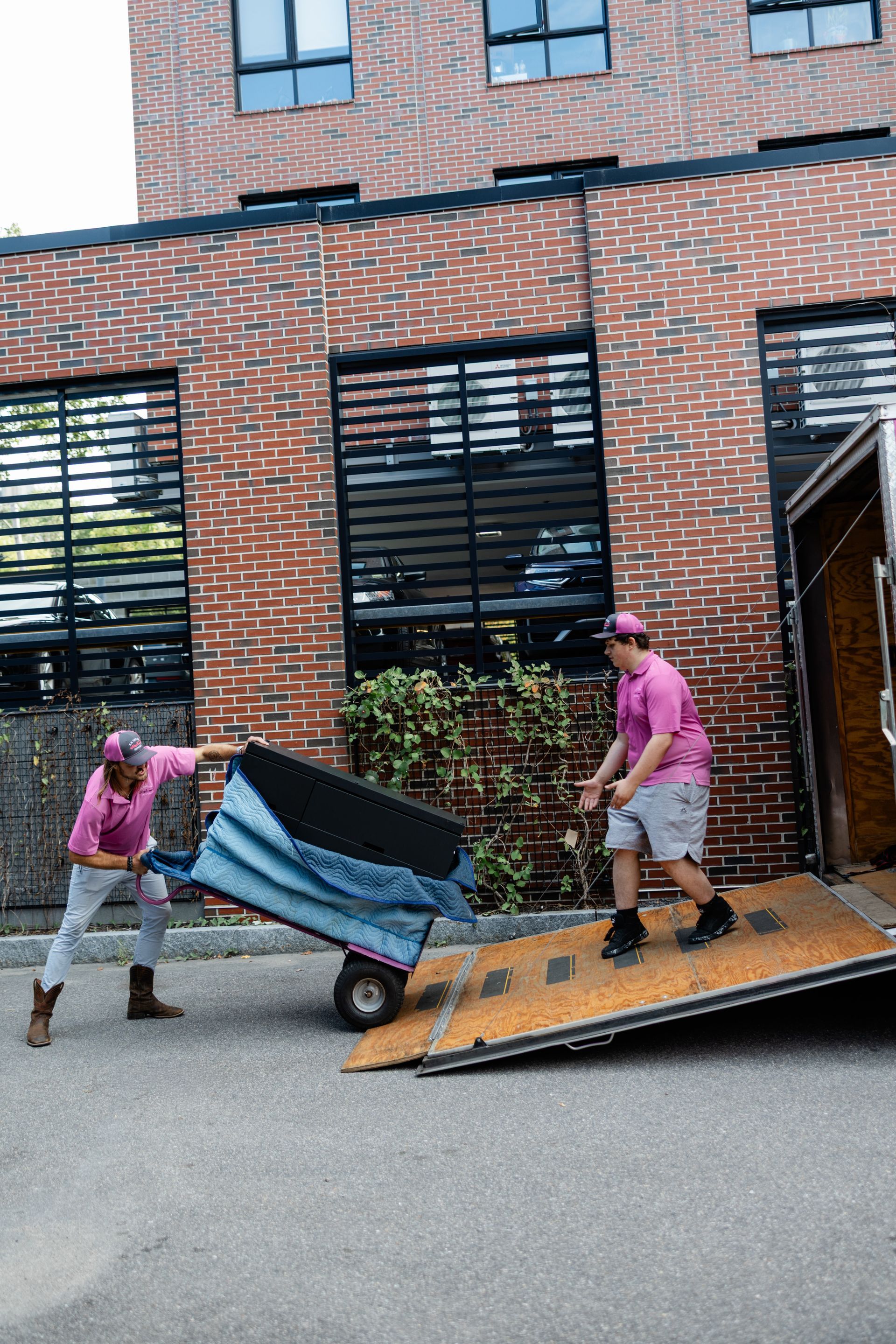 Two Movers Loading Moving Trailer