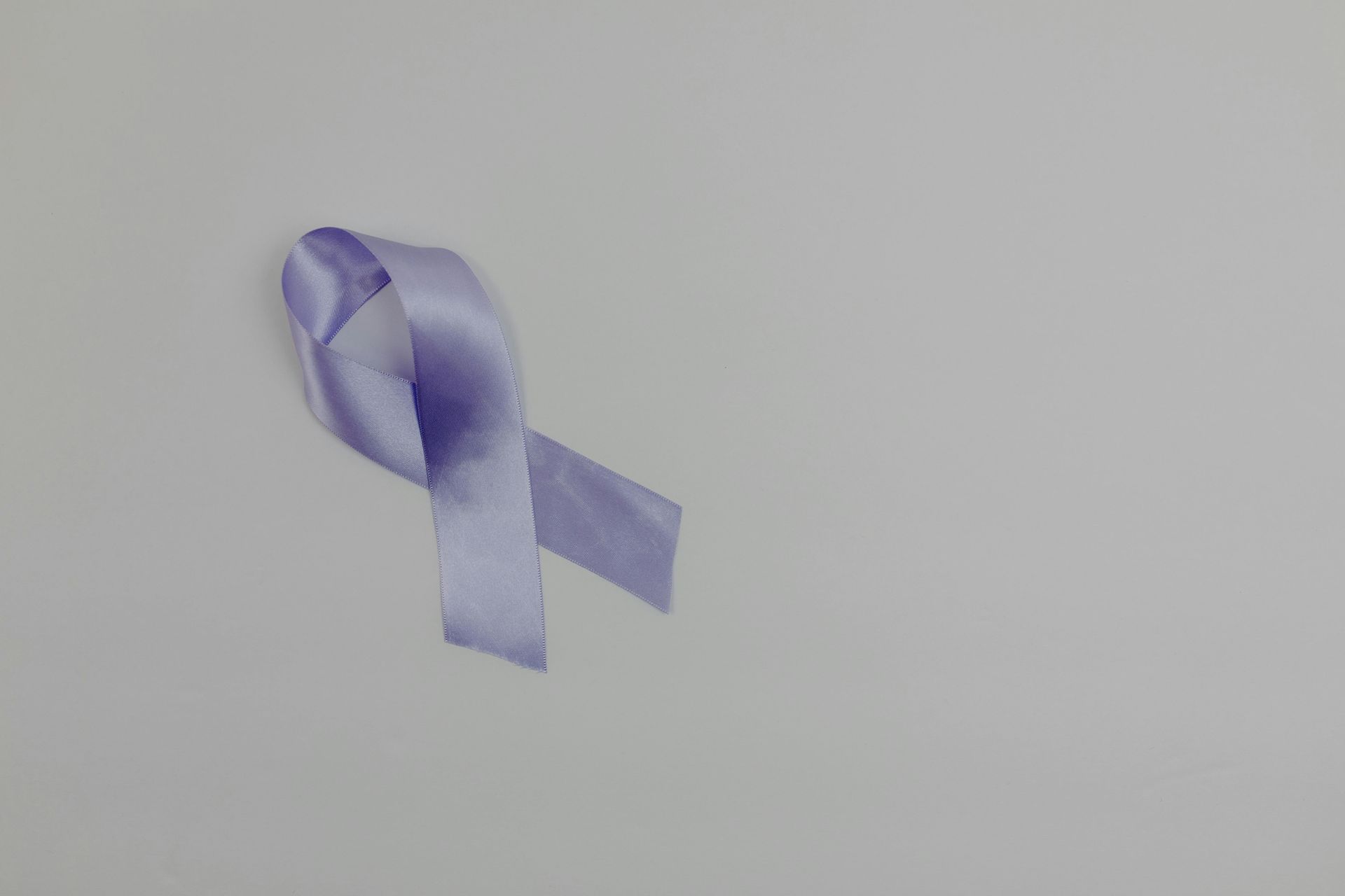 Purple ribbon symbol for Alzheimer's and dementia awareness