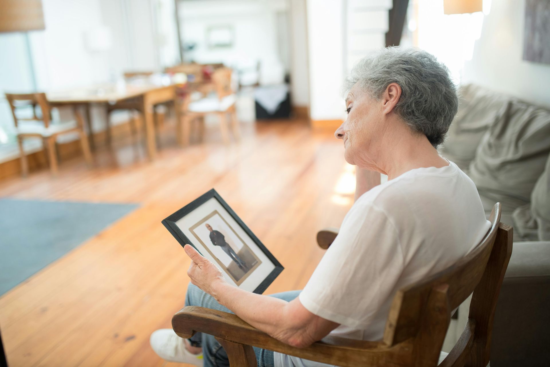 woman sitting looking at picture
