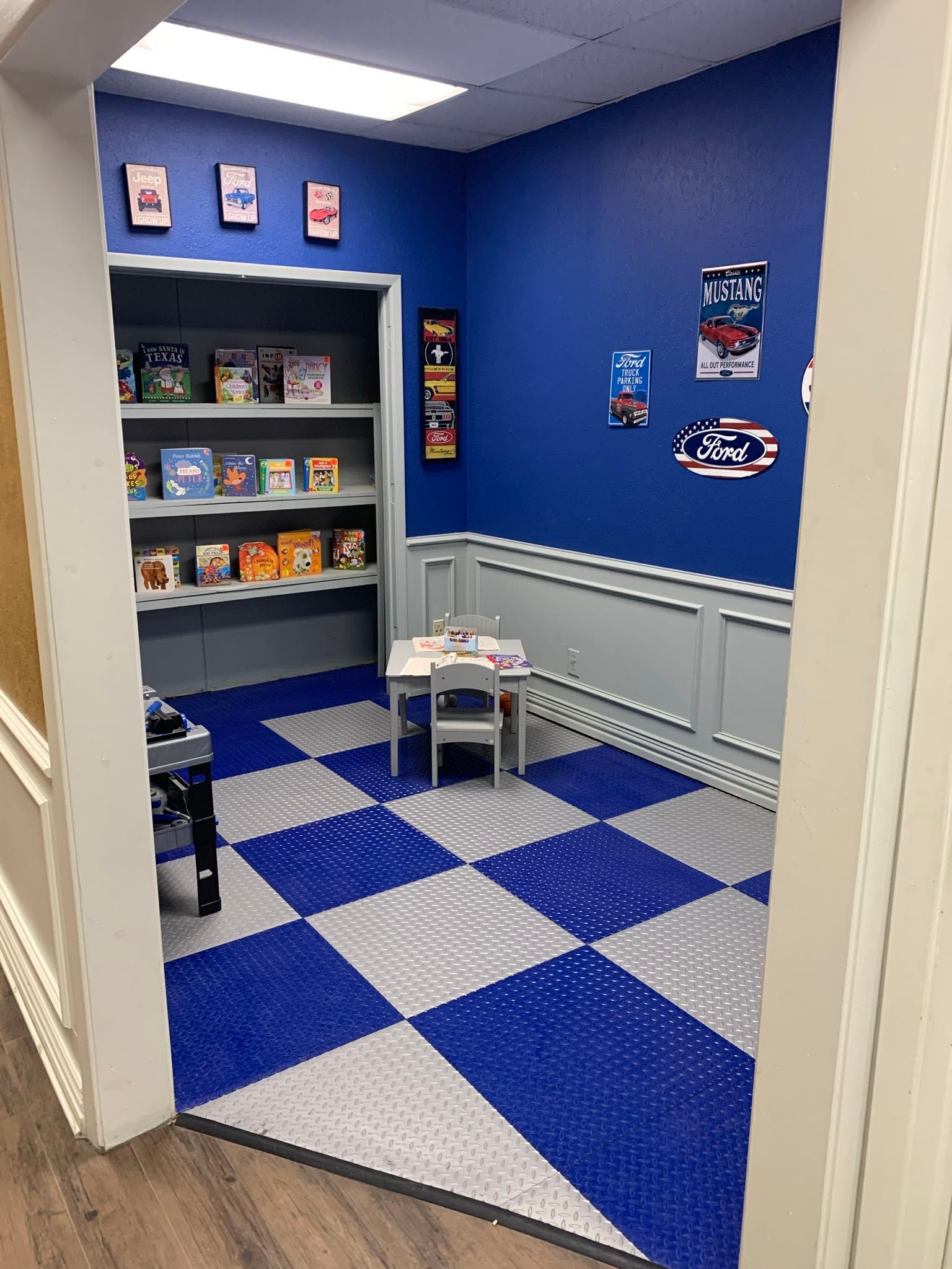 A room with blue walls and a checkered floor.