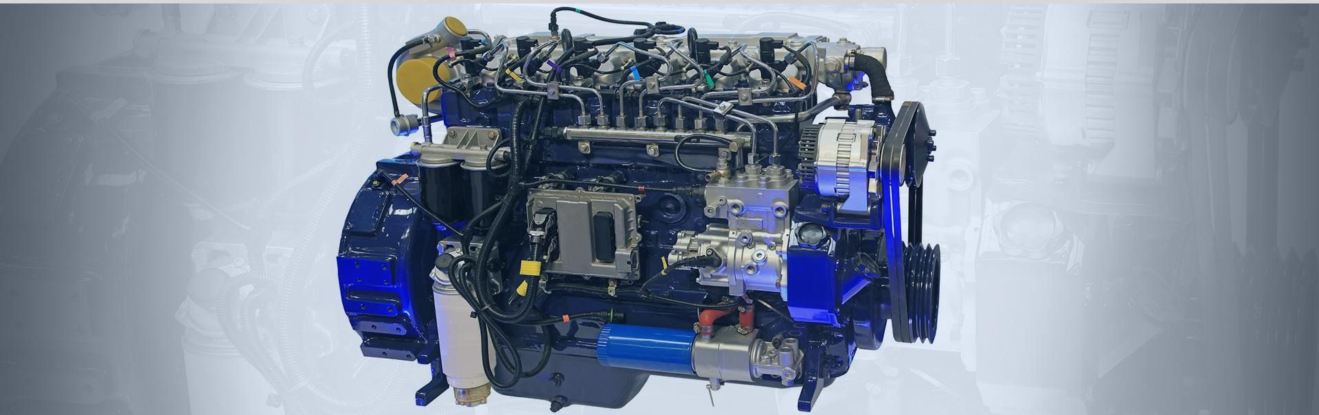 Motor o conjunto mecánico a la vista con detalles azules sobre un fondo gris claro.