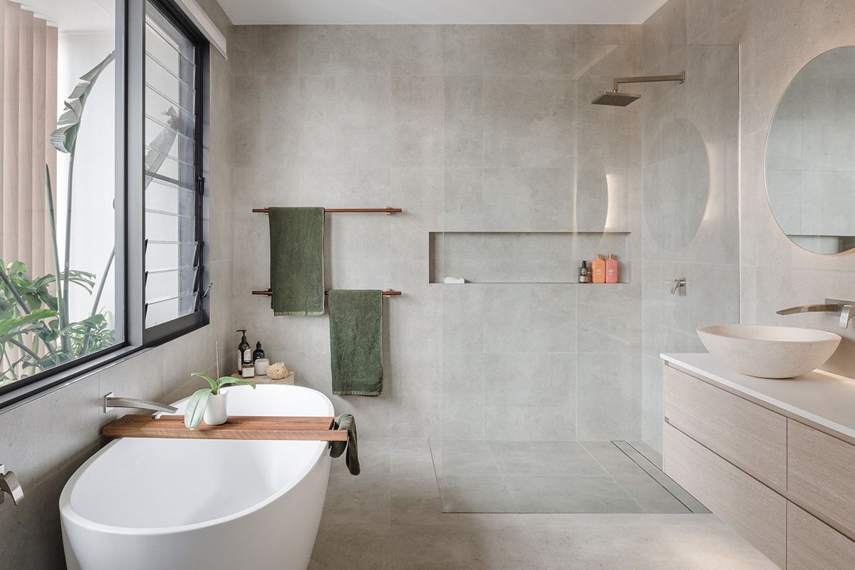 A Bathroom With A Bathtub, Sink And Shower — QBC Constructions In Werri Beach, NSW