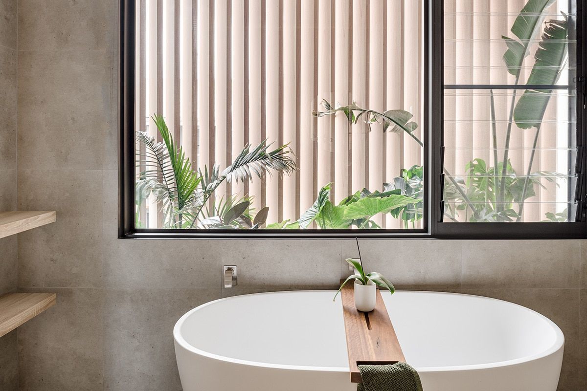 A Bathroom With A Bathtub And A Window — QBC Constructions In Werri Beach, NSW