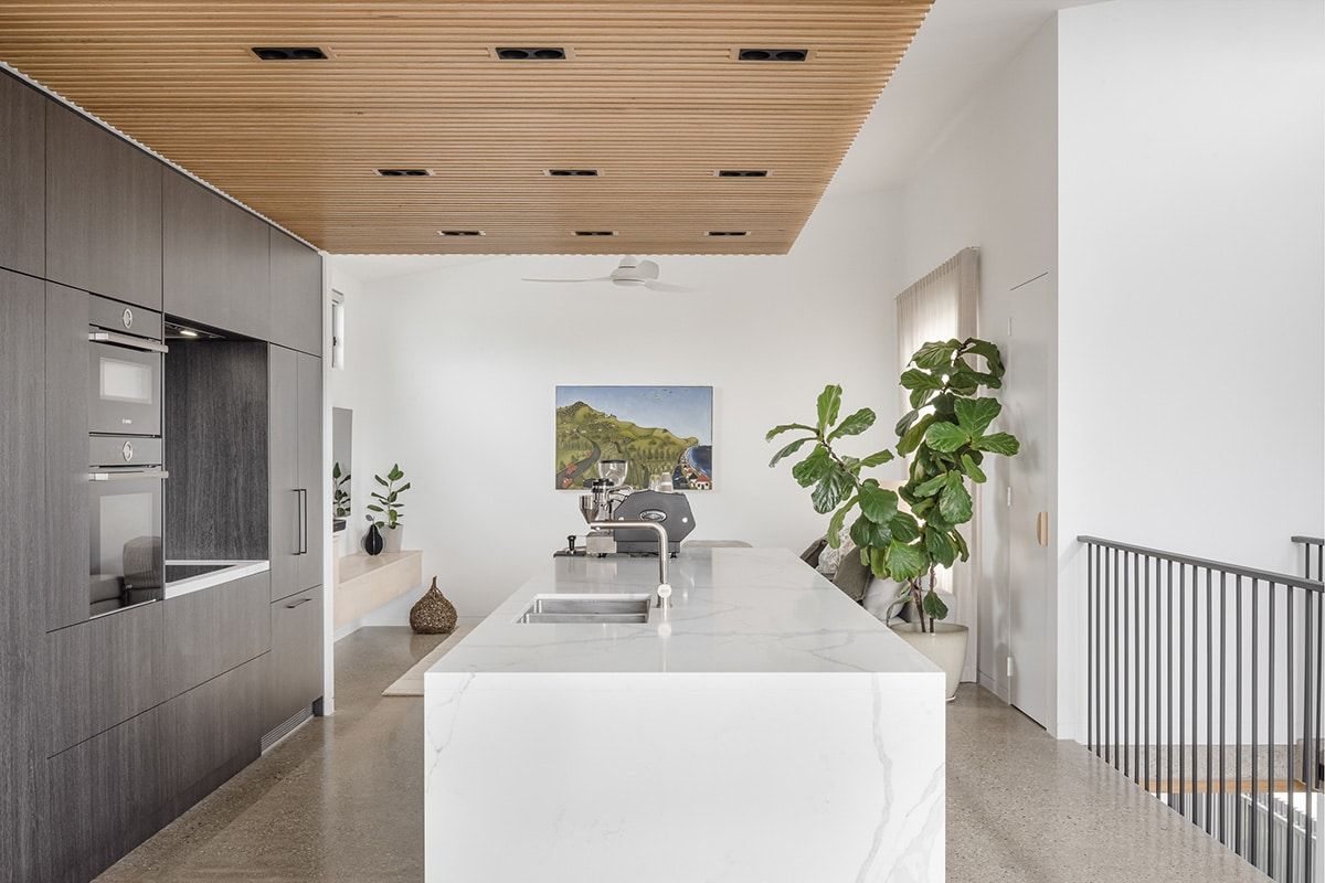 There Is A Large Island In The Middle Of The Kitchen — QBC Constructions In Werri Beach, NSW