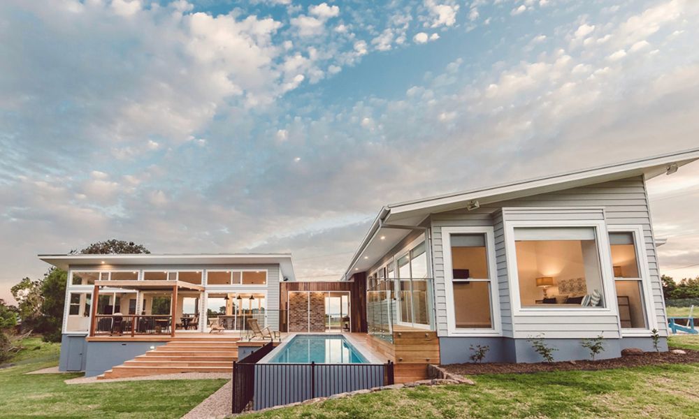 A Modern House With a Large Swimming Pool in the Backyard — QBC Constructions In Willow Vale, NSW