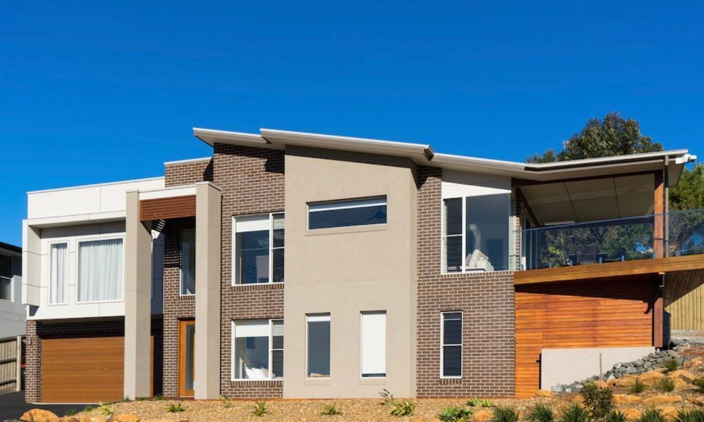 A Large House With a Lot of Windows is Sitting — QBC Constructions In Gerringong, NSW
